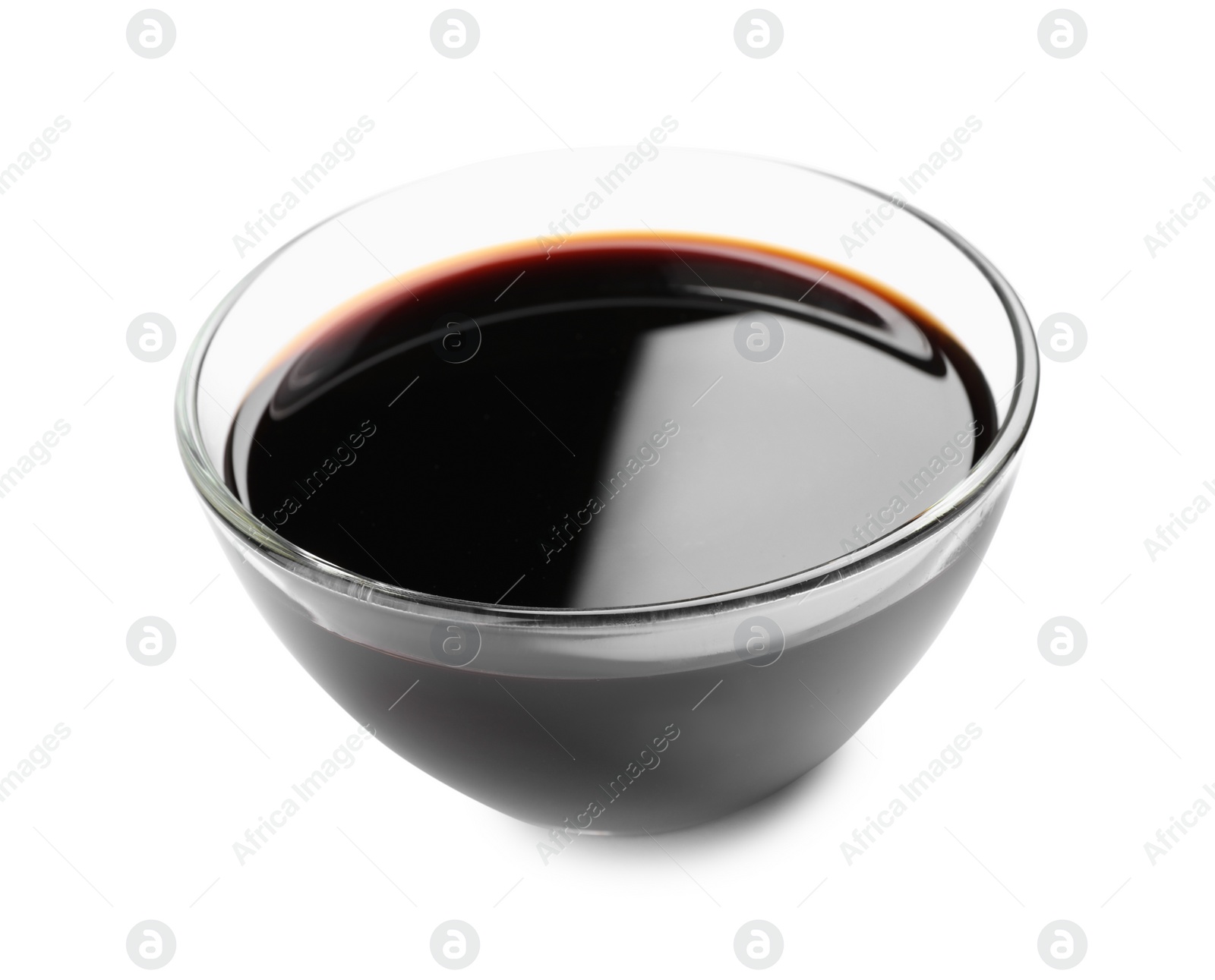 Photo of Bowl of soy sauce isolated on white