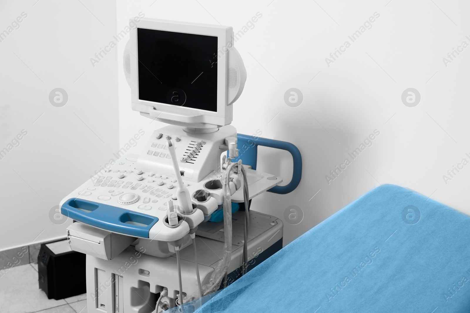 Photo of Ultrasound machine and examination table in hospital