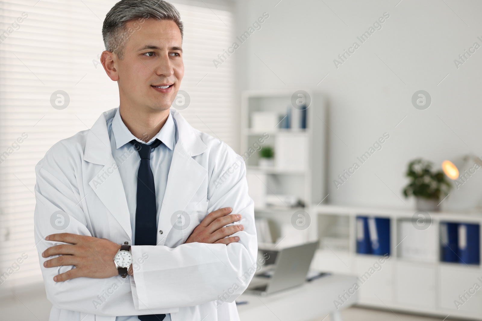 Photo of Portrait of doctor in clinic, space for text