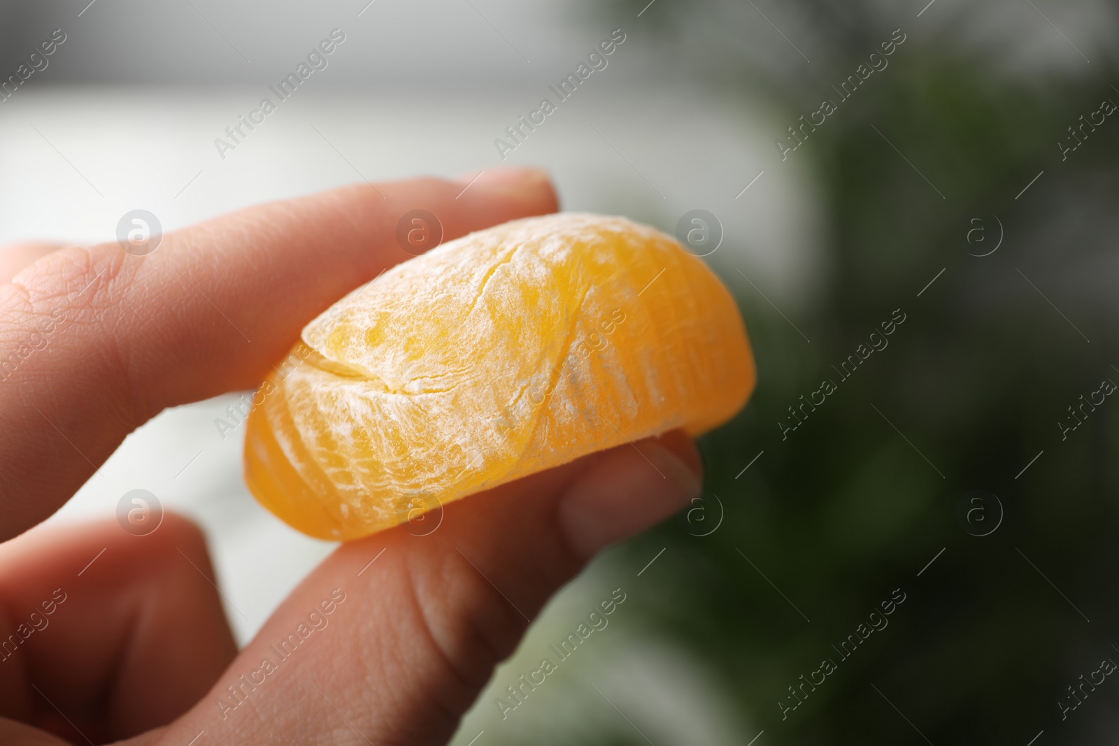 Photo of Woman holding delicious mochi, closeup. Japanese cuisine