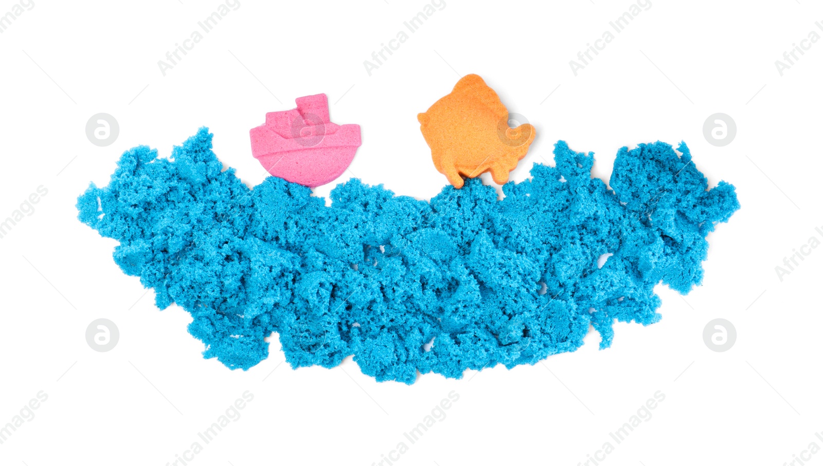 Photo of Ship, fish and sea made of kinetic sand on white background, top view