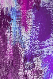 Image of Strokes of colorful acrylic paints on white canvas, closeup