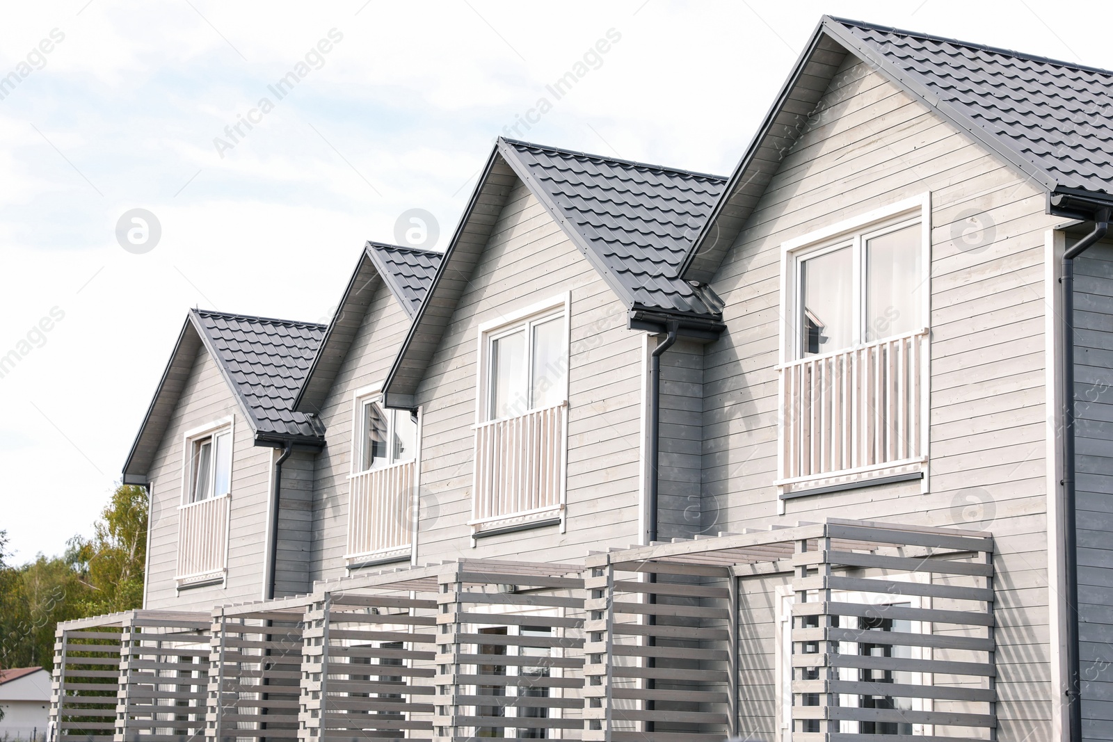 Photo of Exterior of beautiful modern white houses outdoors