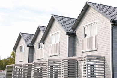 Photo of Exterior of beautiful modern white houses outdoors