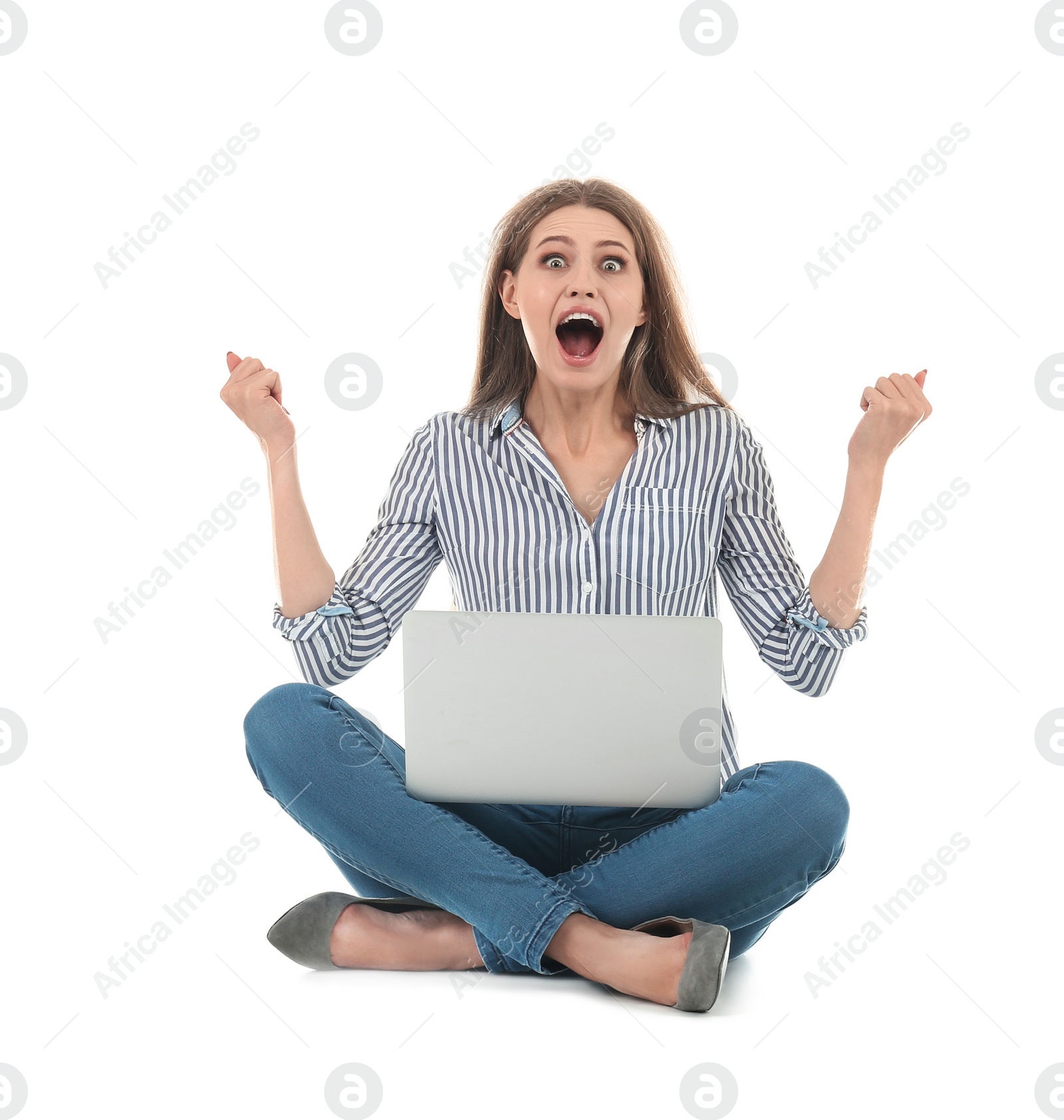 Photo of Emotional young woman with laptop celebrating victory on white background