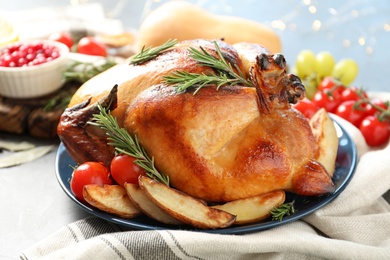 Delicious roasted turkey for traditional festive dinner on table