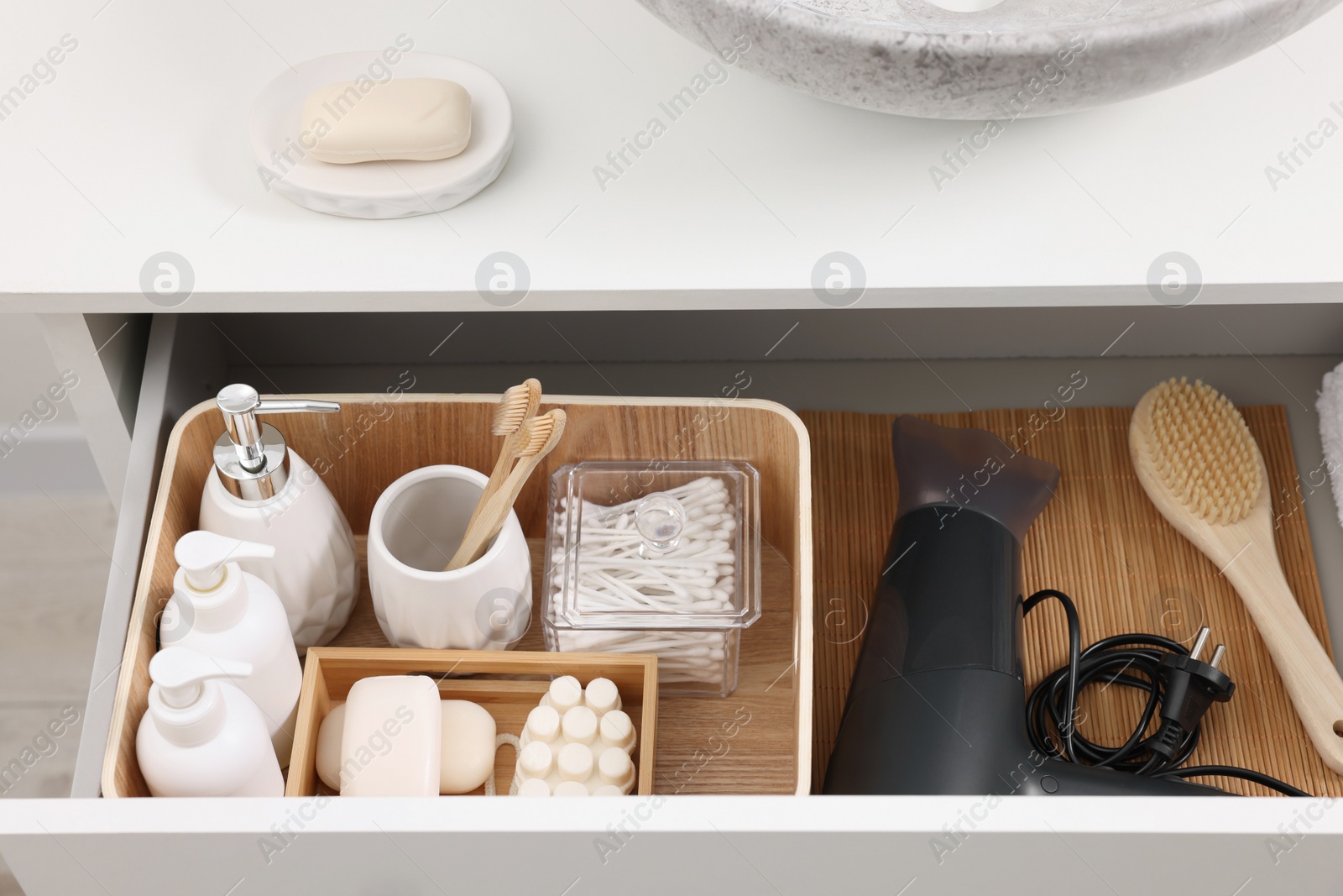 Photo of Different bath accessories and personal care products in drawer indoors