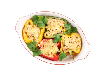 Photo of Tasty stuffed bell peppers in baking dish isolated on white, top view