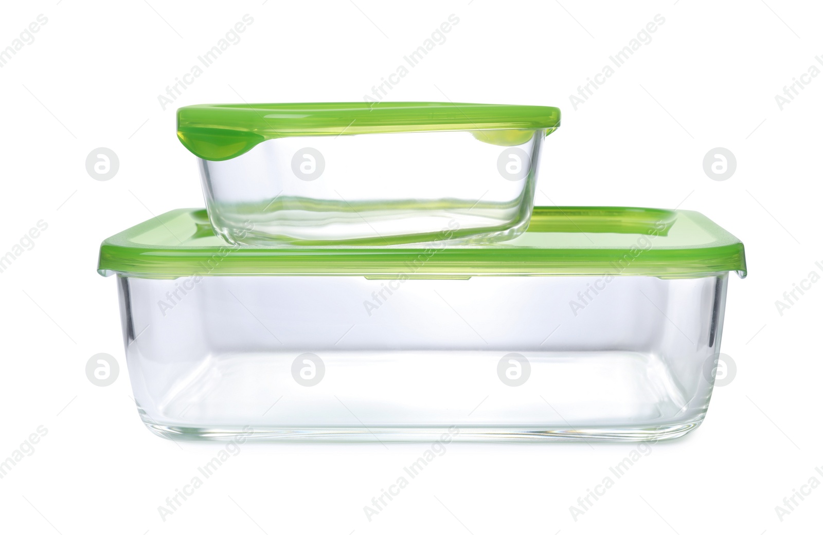 Photo of Empty glass containers for food on white background