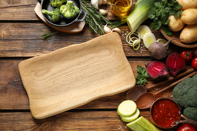 Photo of Flat lay composition with fresh products on wooden table. Healthy cooking
