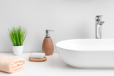 Set of different bath accessories and products on white table