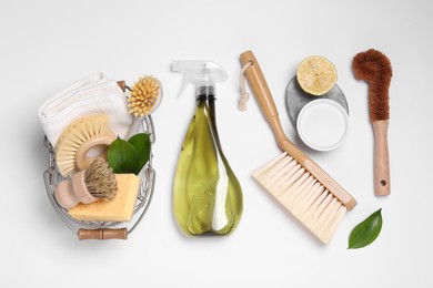 Flat lay composition with different cleaning supplies on white background