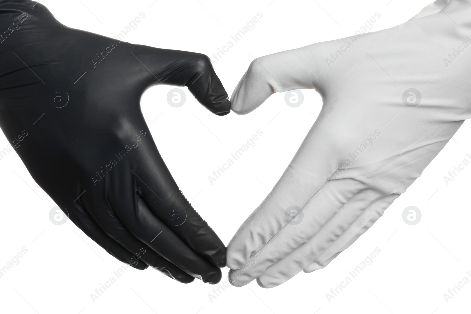 Photo of Doctor making heart shape with hands in different medical gloves on white background