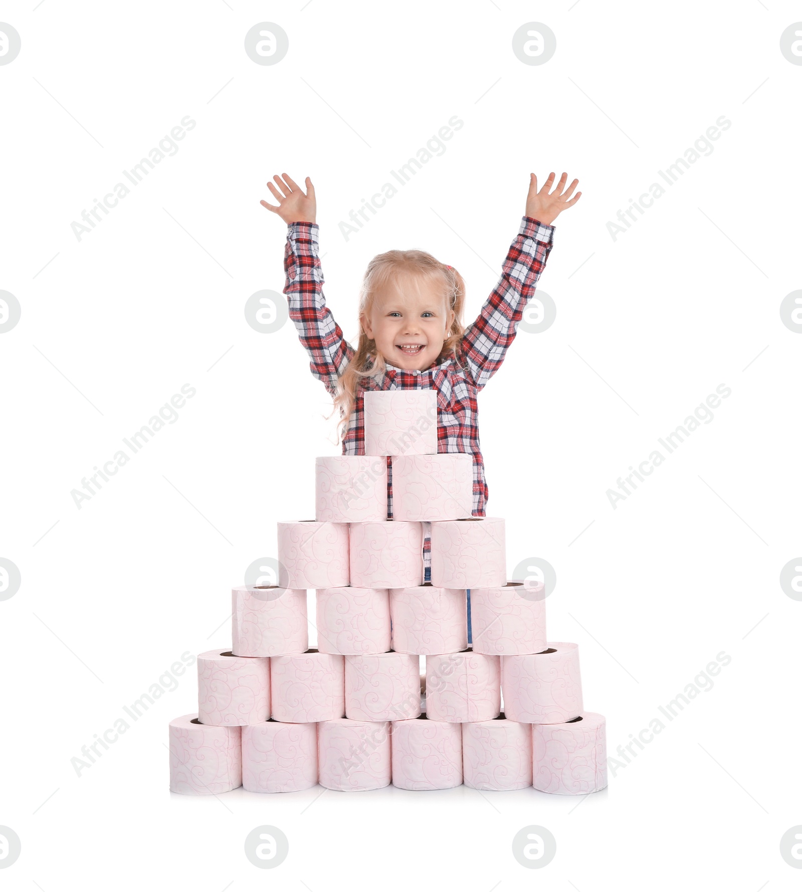 Photo of Cute little girl and toilet paper pyramid on white background