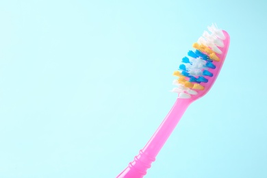 Photo of Manual toothbrush on color background. Dental care