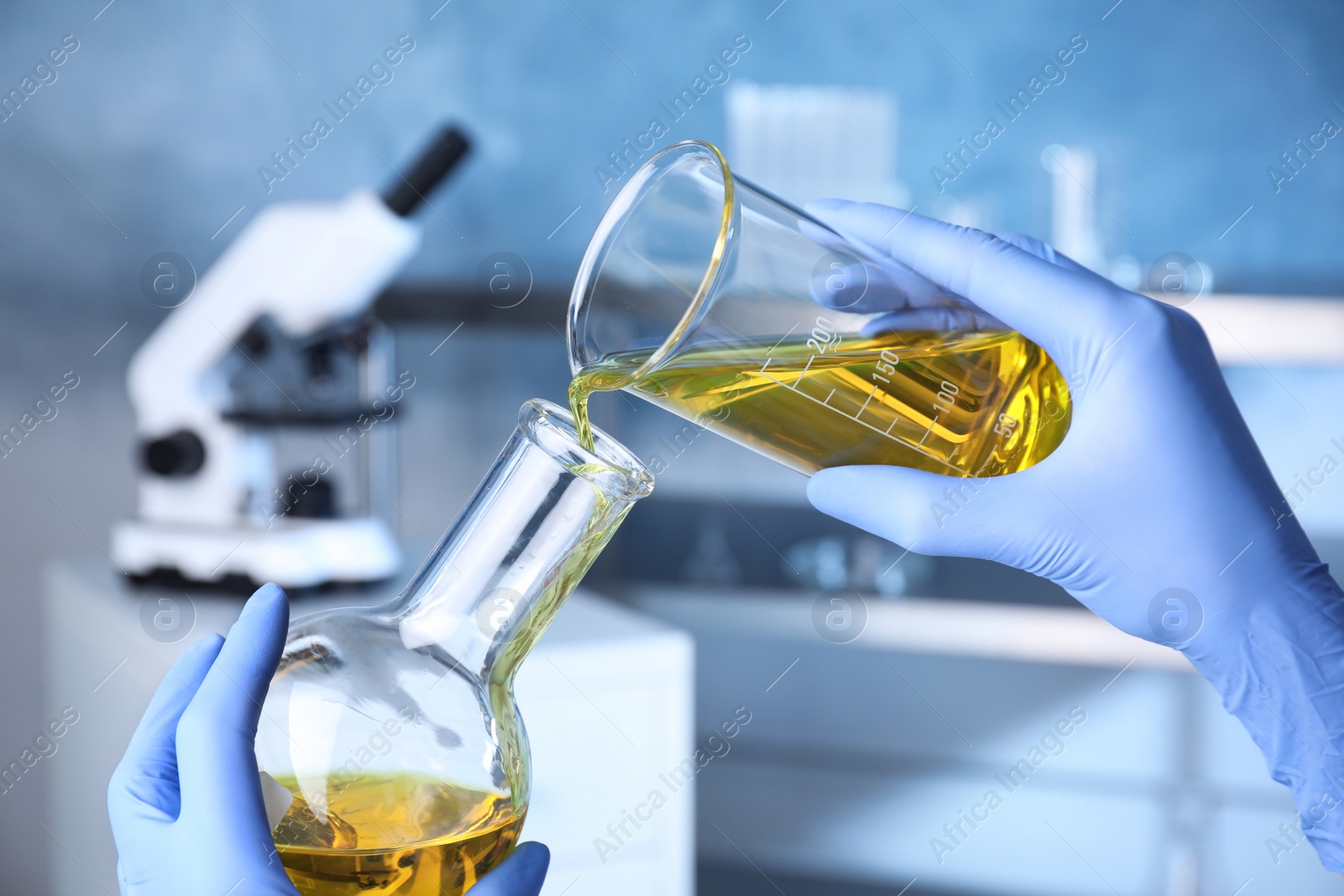 Photo of Scientist doing analysis in lab, closeup. Solution chemistry