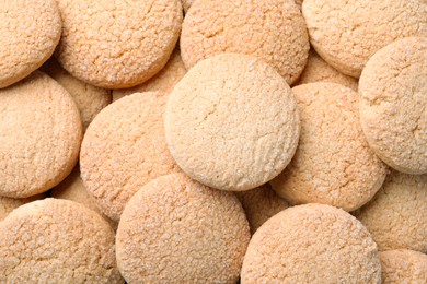 Tasty sugar cookies as background, top view