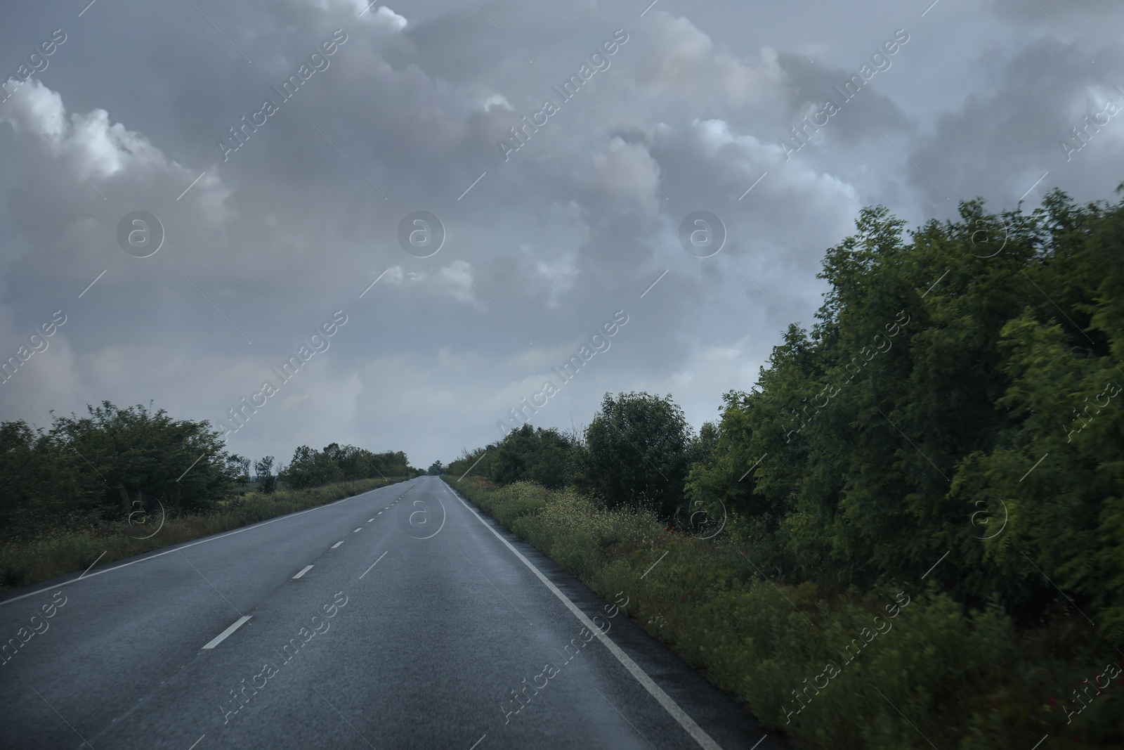 Photo of Beautiful view of country road with car