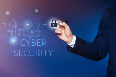 Cyber security concept. Businessman on dark blue background, closeup