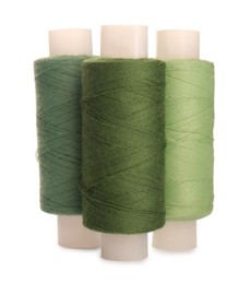 Different colorful sewing threads on white background