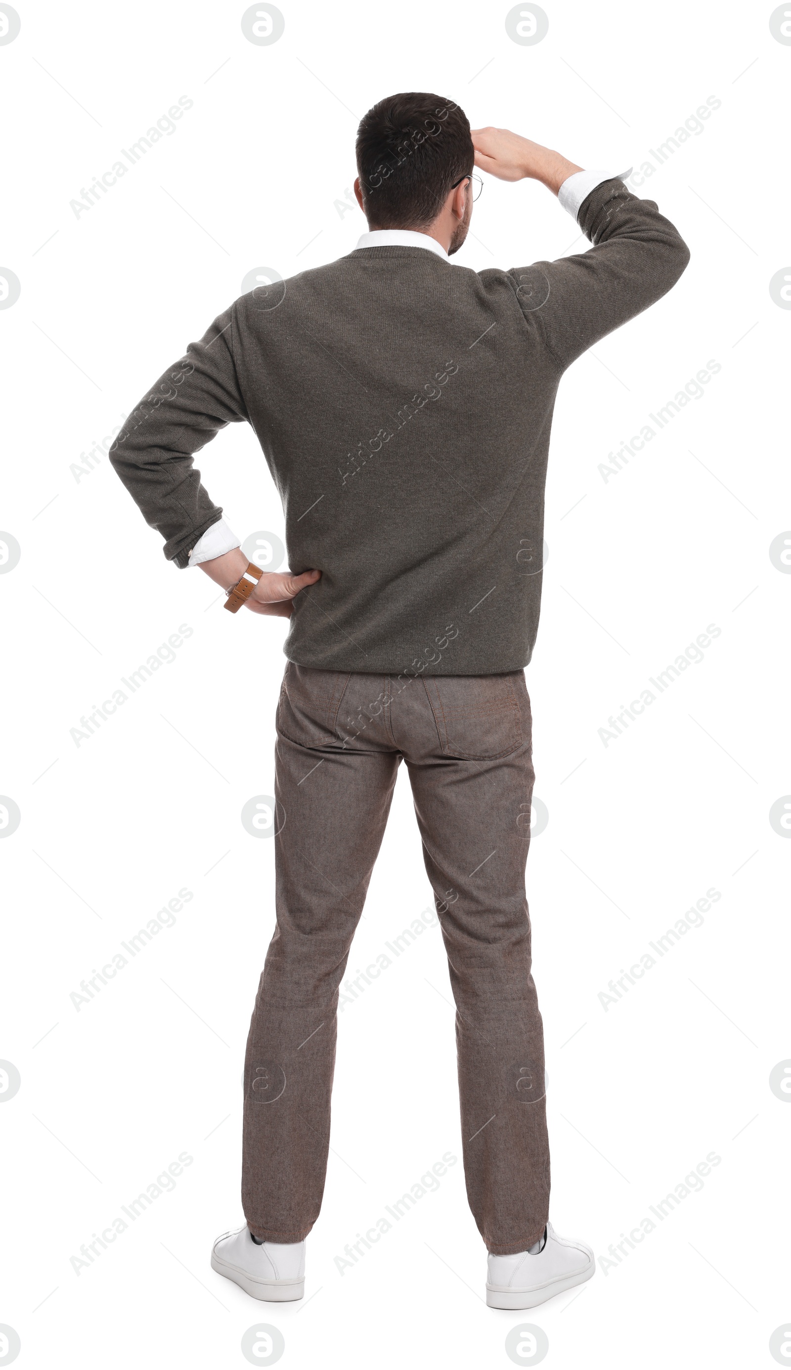 Photo of Businessman standing on white background, back view