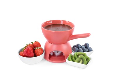 Photo of Fondue pot with melted chocolate, fresh berries and kiwi isolated on white