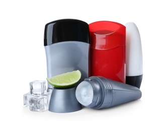 Photo of Different natural male deodorants with ice and lime on white background. Skin care
