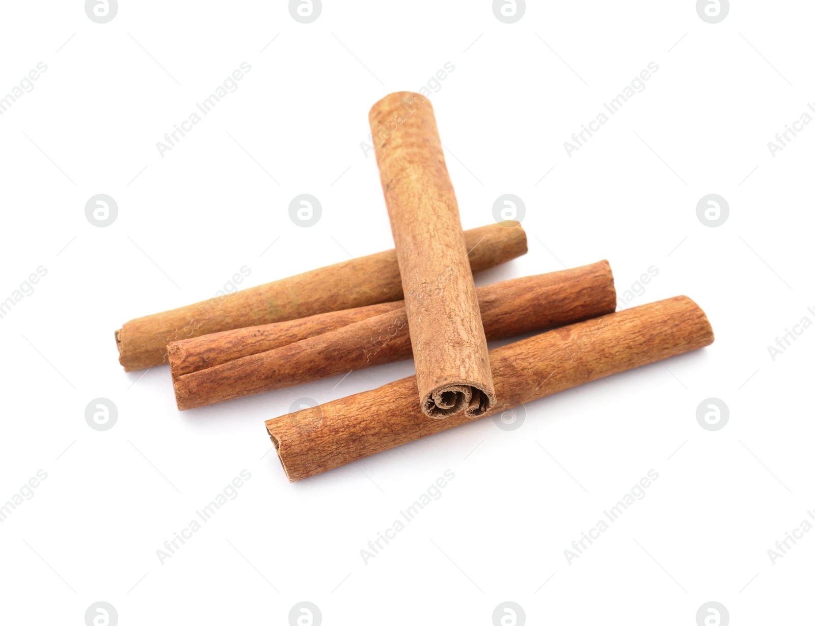 Photo of Aromatic cinnamon sticks on white background