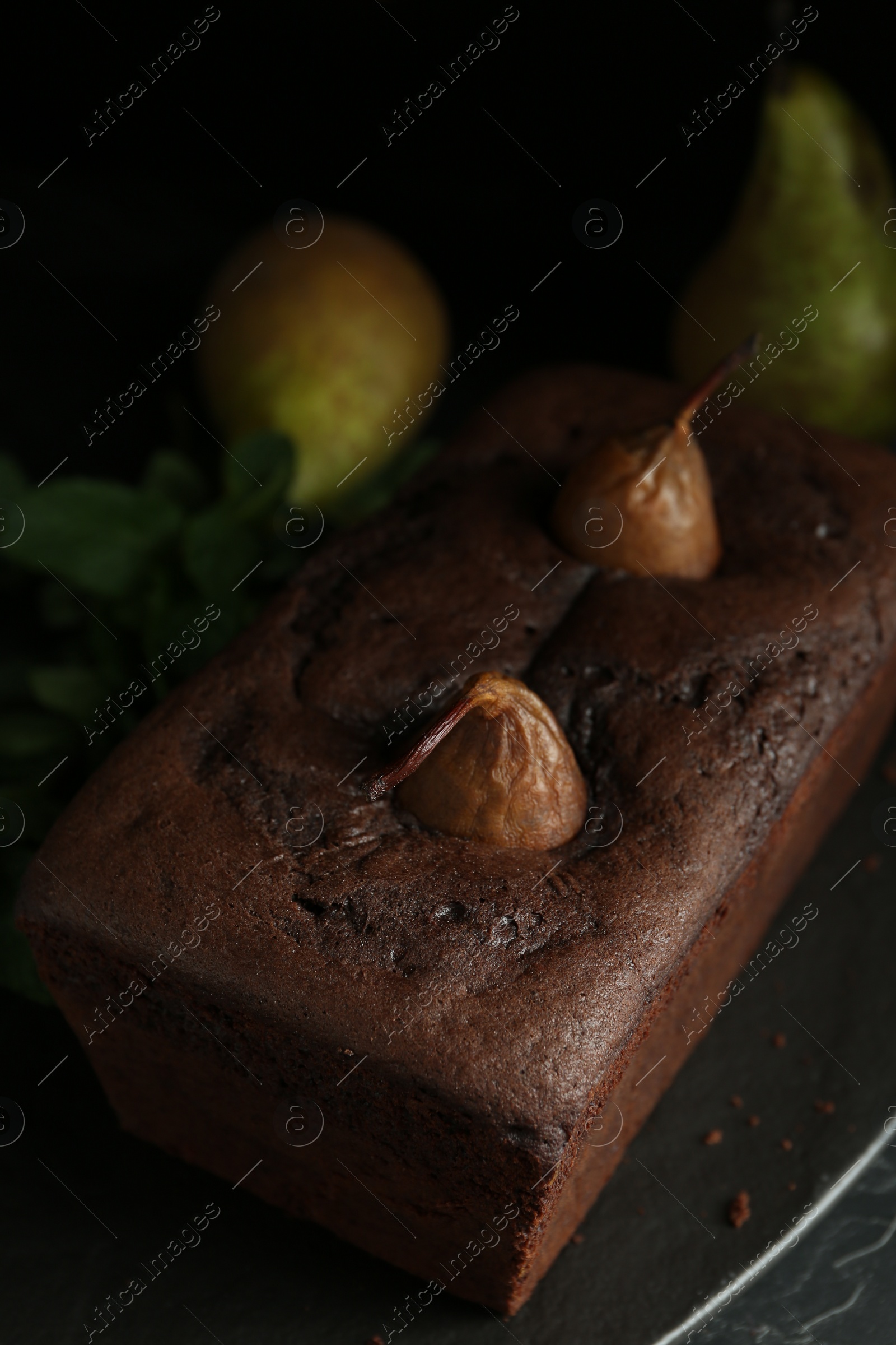 Photo of Tasty pear bread on slate board. Homemade cake