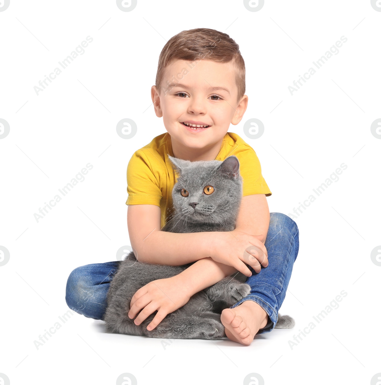 Photo of Cute little child with cat on white background