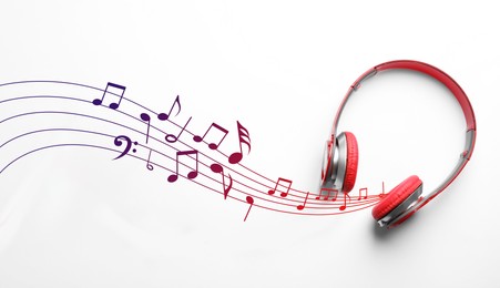 Image of Staff with music notes flowing from red headphones on white background, top view