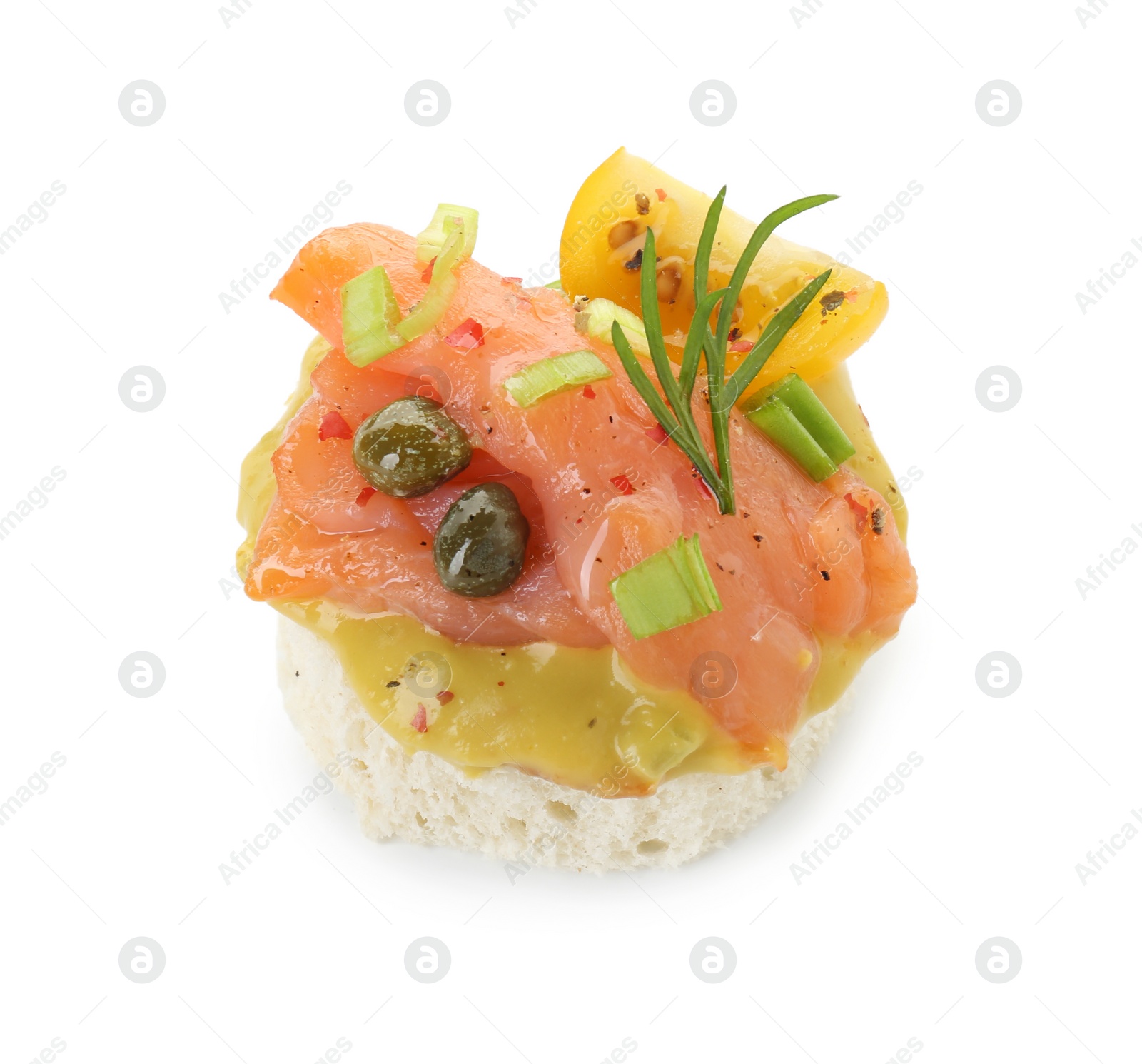 Photo of Tasty canape with salmon, tomatoes, capers and herbs isolated on white