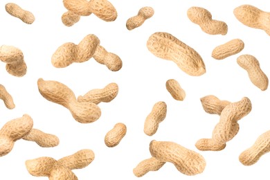 Image of Unpeeled peanuts in air on white background