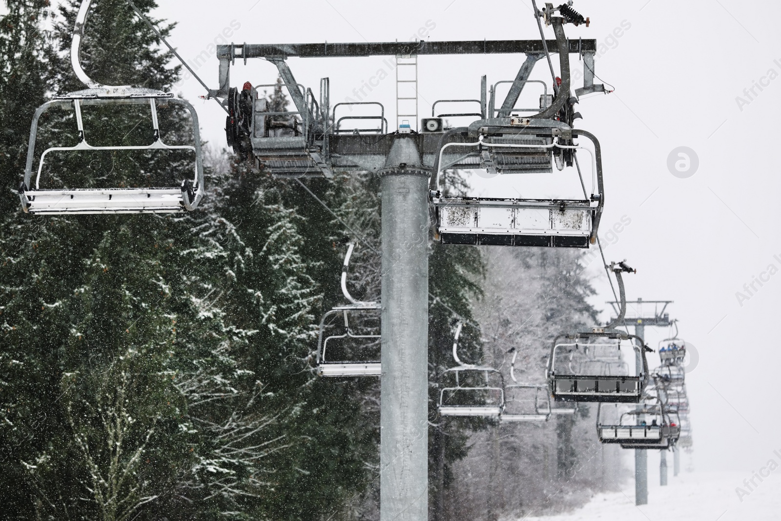 Photo of Ski lift at mountain resort. Winter vacation