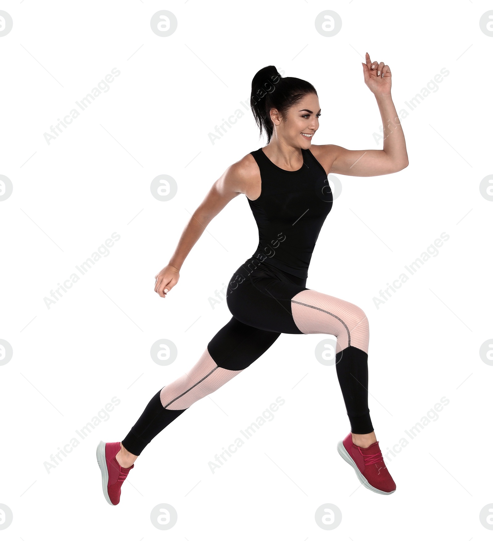 Photo of Sporty young woman running on white background