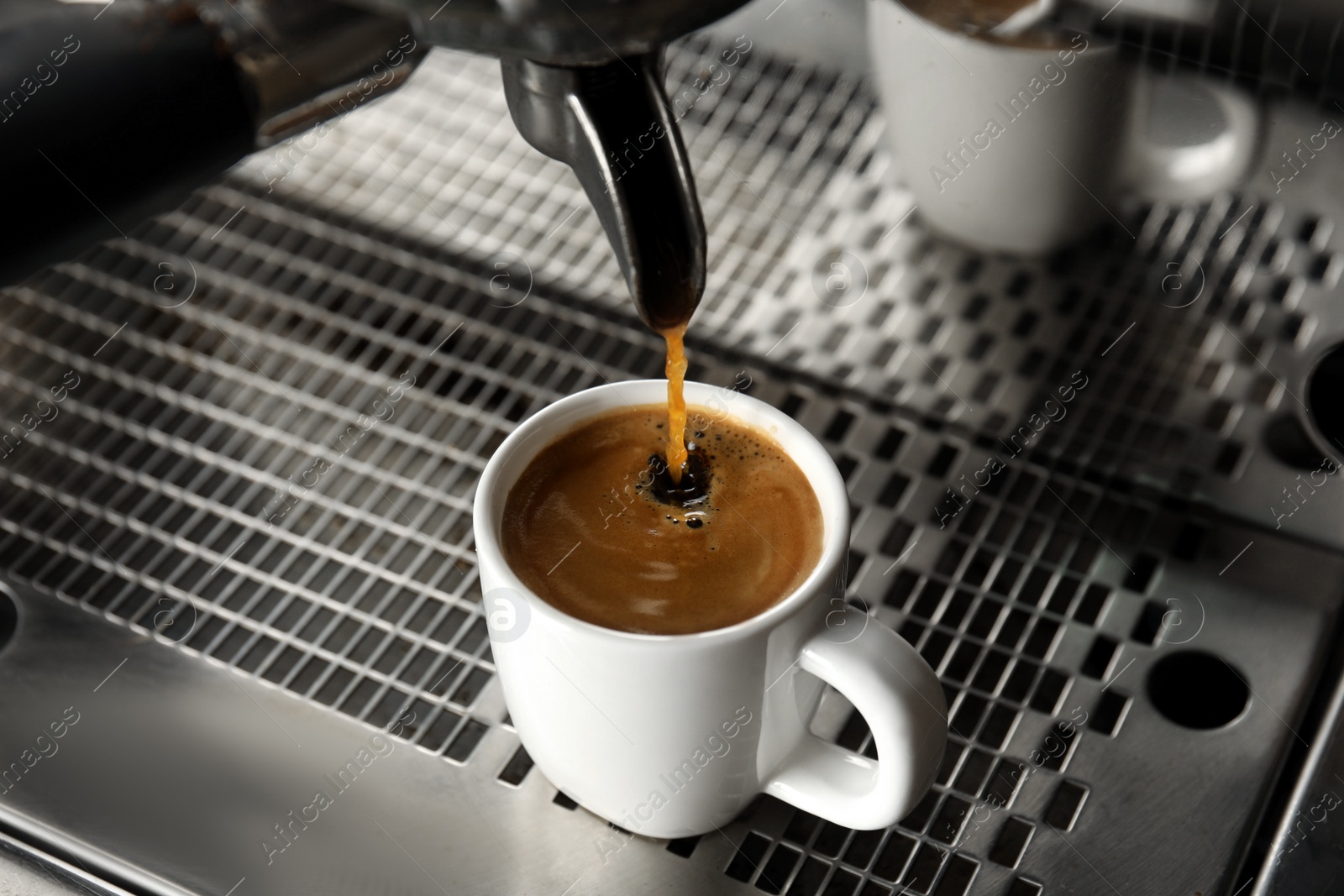 Photo of Making fresh aromatic espresso using professional coffee machine