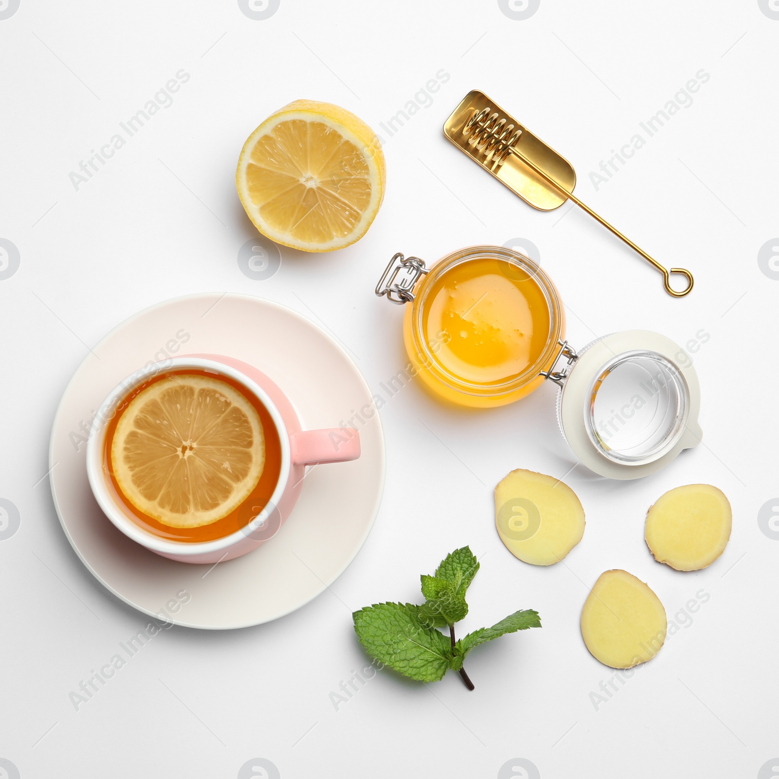 Photo of Composition with lemon tea, honey and ginger on white background, top view