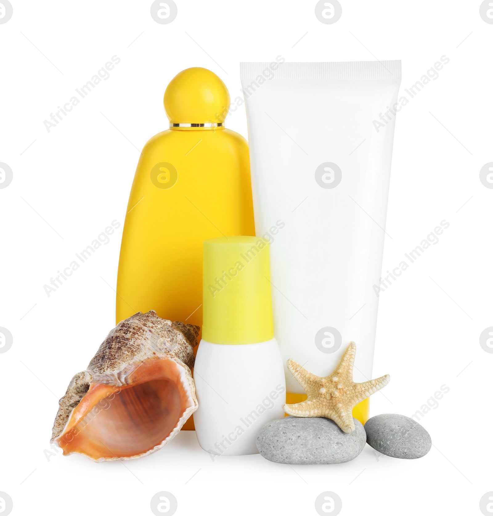 Photo of Different suntan products, seashell, starfish and stones on white background