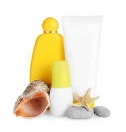 Photo of Different suntan products, seashell, starfish and stones on white background