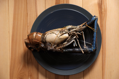 Fresh malaysian freshwater prawn on wooden table, top view