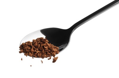 Photo of Pouring instant coffee from spoon on white background