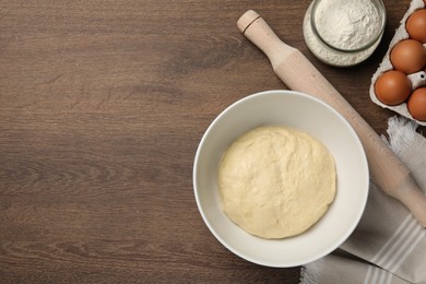 Cooking scones with soda water. Dough and ingredients on wooden table, flat lay. Space for text