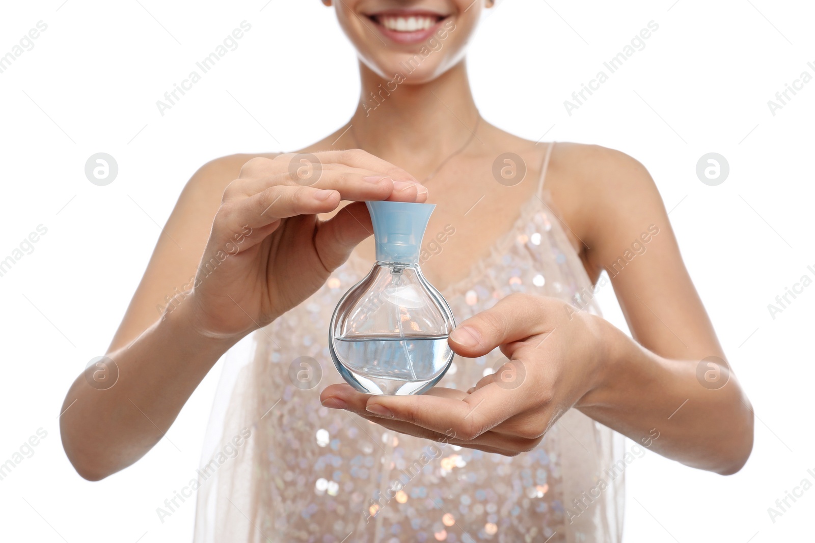 Photo of Young woman with perfume bottle on white background, closeup