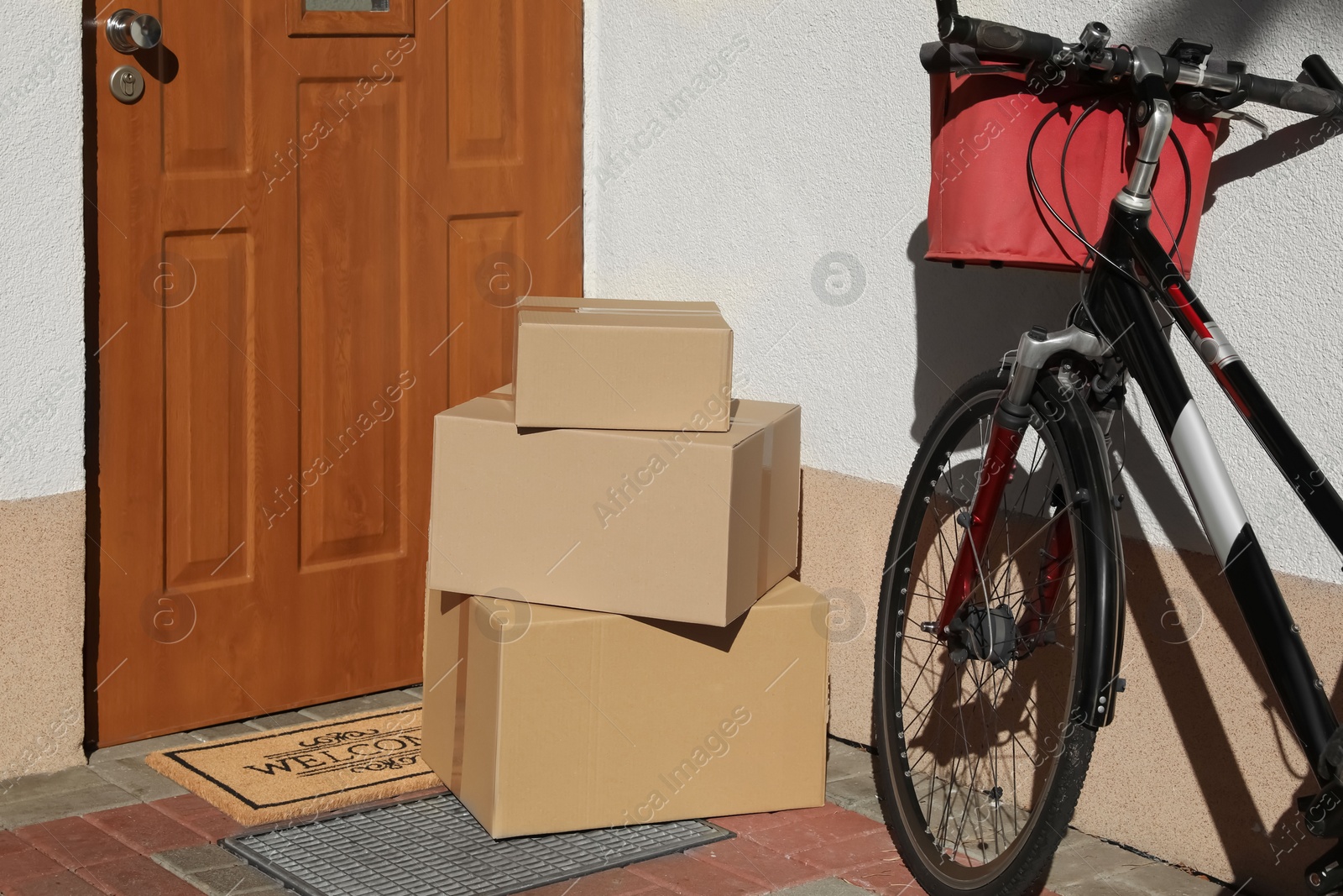 Photo of Parcels delivered on mat near front door