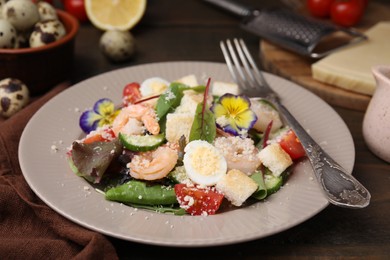 Photo of Delicious Caesar salad with shrimps on table, closeup