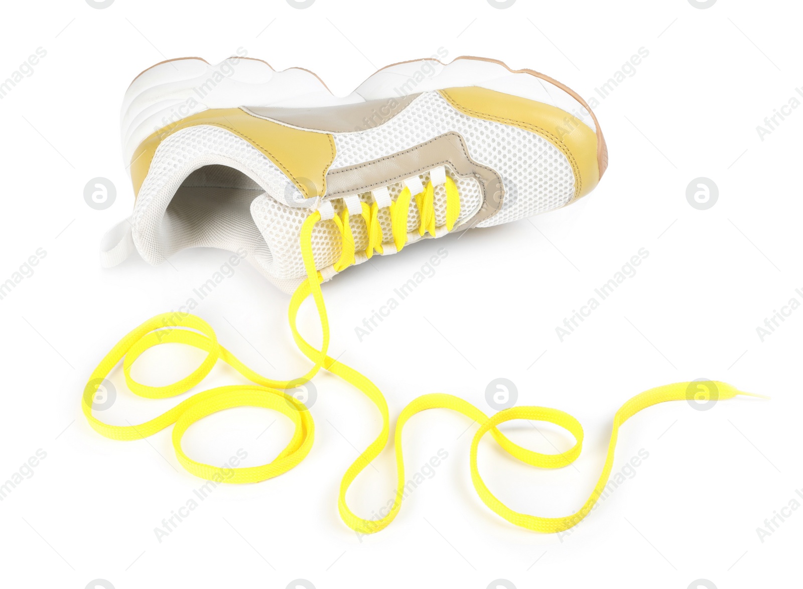 Photo of Stylish shoe and word Love made with yellow laces on white background