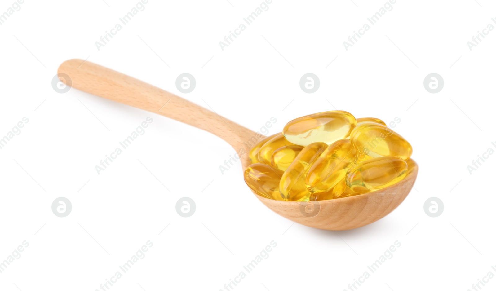 Photo of Vitamin capsules in wooden spoon isolated on white