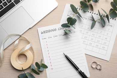 Photo of Flat lay composition with Wedding Checklist and calendar on white wooden table