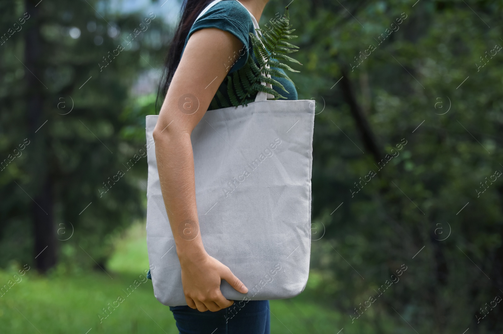 Photo of Woman with eco bag outdoors. Mockup for design