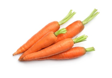 Photo of Fresh ripe carrots on white background, top view